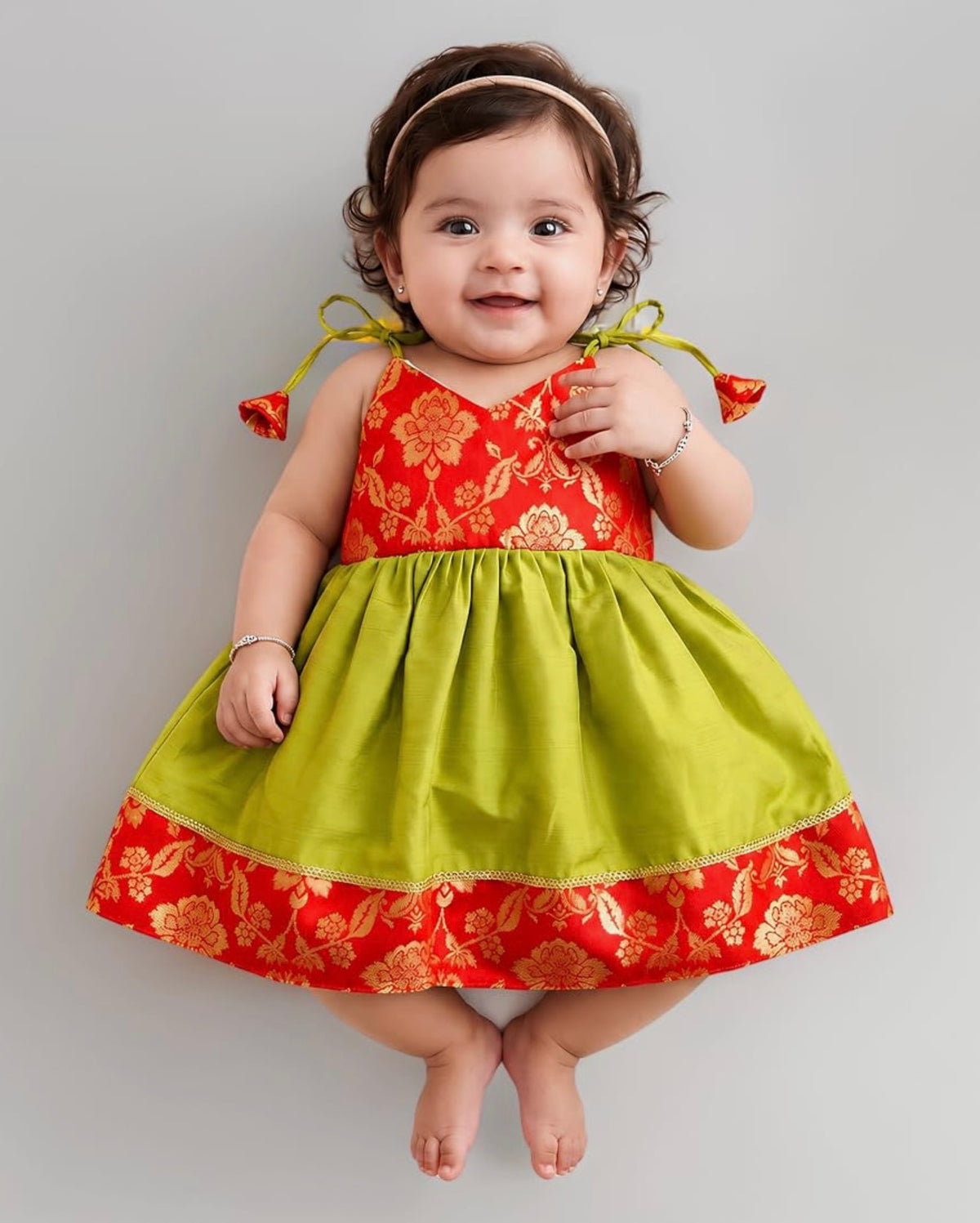 BABY GIRL STYLISH BANARASI SILK FROCK WITH MATCHING BOW - GREEN & RED