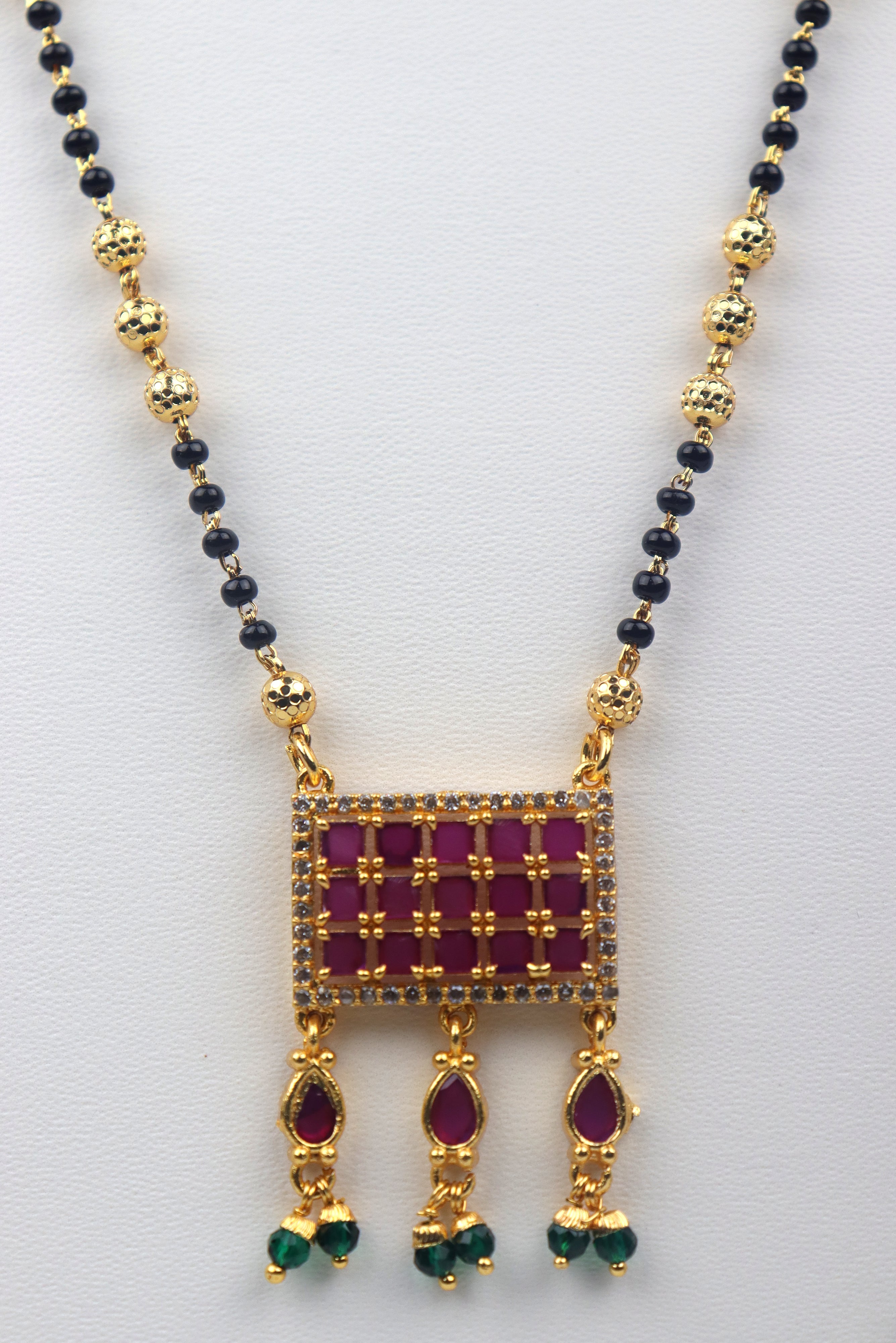 GOLD PLATED MANGALSUTRA STUDDED WITH KEMP STONES GRABO365