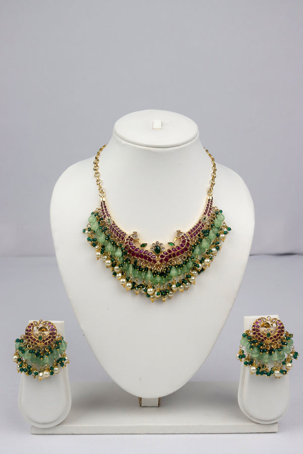 DANGLING PASTEL GREEN AND KEMP STONE EMBELLISHED PEACOCK DESIGN CHOKER WITH EARRINGS SET GRABO365