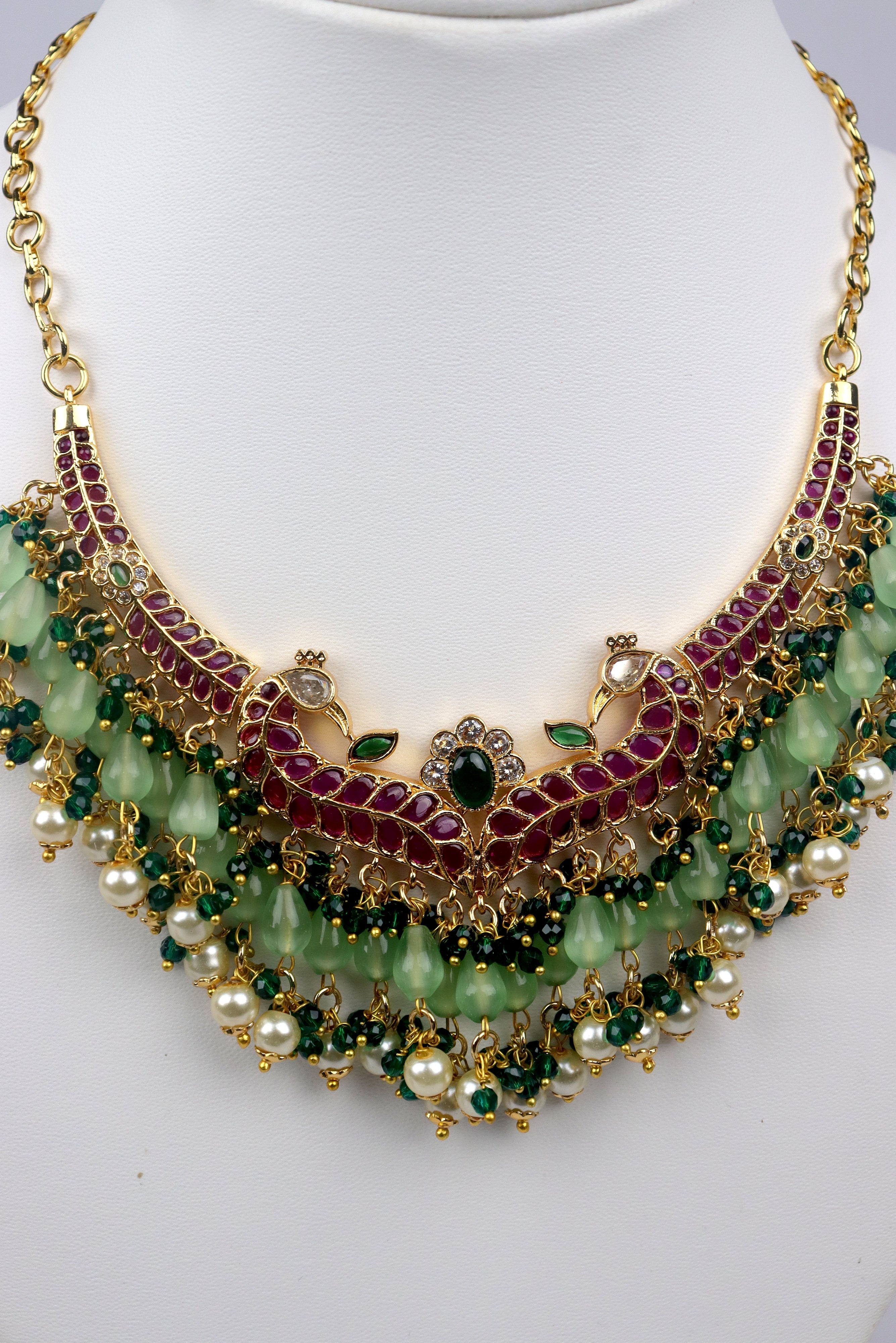 DANGLING PASTEL GREEN AND KEMP STONE EMBELLISHED PEACOCK DESIGN CHOKER WITH EARRINGS SET GRABO365